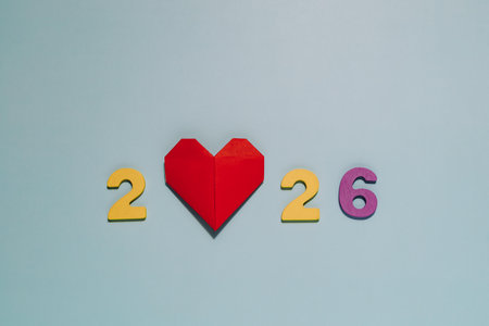 2026 with a vibrant red origami heart on blue. Perfect for themes of love, hope, and the future...