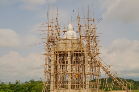 White marble Buddha statue under constructionの写真素材