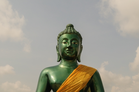 Half green buddha at Thailandの写真素材