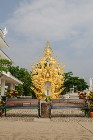 Benches with golden sculpture backgroundの写真素材