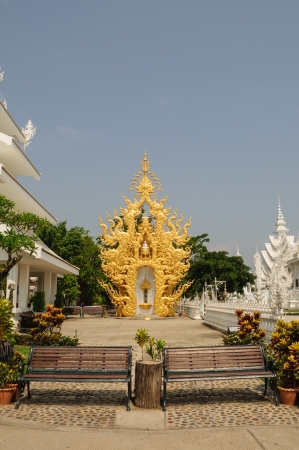 Benches with golden sculpture backgroundの写真素材