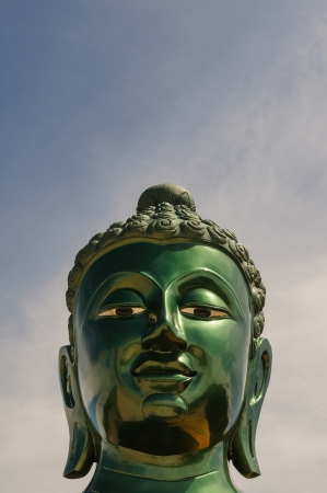 Close up of green buddha faceの写真素材