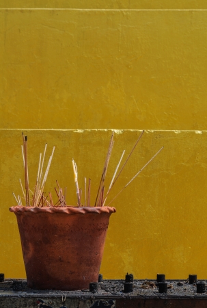 Burning prayer incense at  temple, Thailandの写真素材