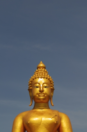 Half buddha statue with bule sky backgroundの写真素材