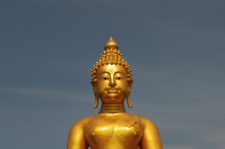 Half buddha statue with bule sky backgroundの写真素材