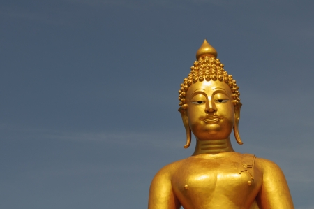 Half buddha statue with bule sky backgroundの写真素材
