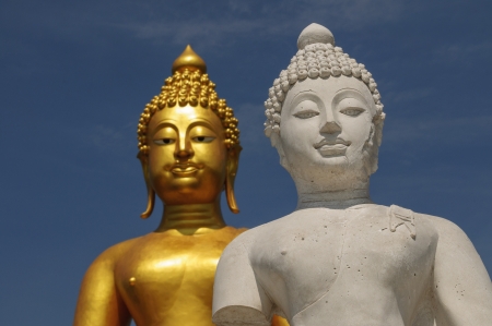 White buddha with golden buddha backgroundの写真素材