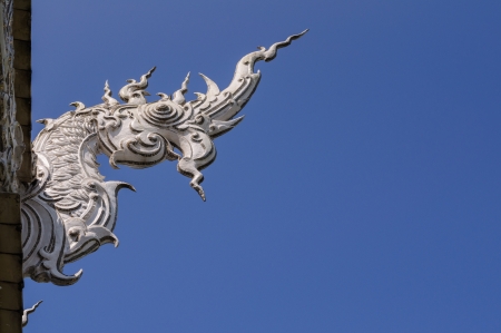 white dragon sculpture at wat rong khun, chiang rai, thailandの写真素材