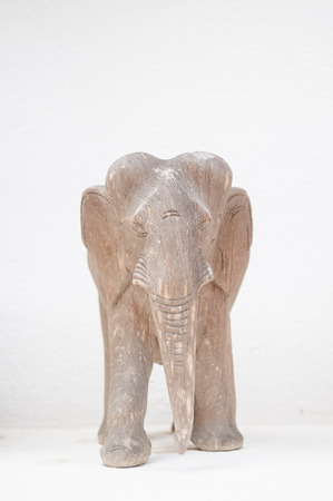 Wooden elephant carving  with white backgroundの写真素材