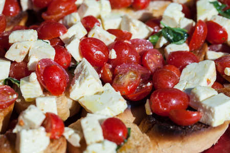 Tomatoes and Feta Cheese on Toastの写真素材