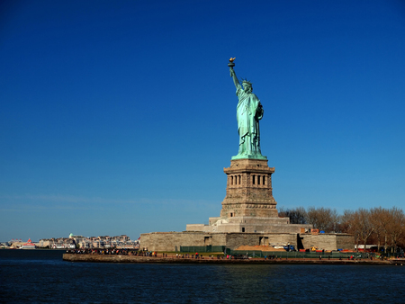 The Statue of Liberty on clear blue skyの写真素材