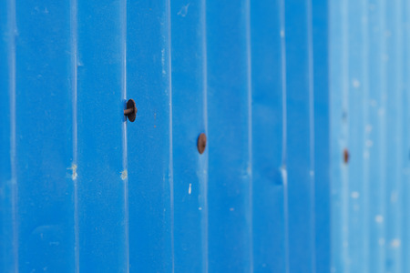 old blue galvanized iron roof or corrugated iron roof and large headed nail
