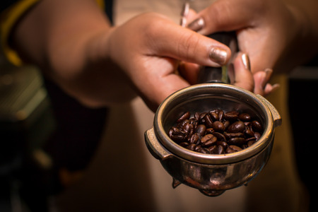 Coffee Maker And Beans on handの写真素材