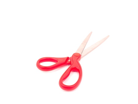 Scissors with red handle on white backgound の写真素材