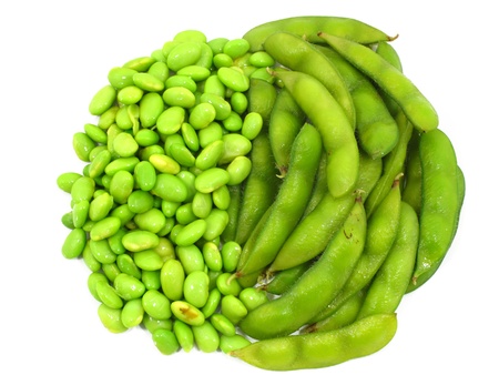 Edamame soy beans shelled and pods on white background の写真素材