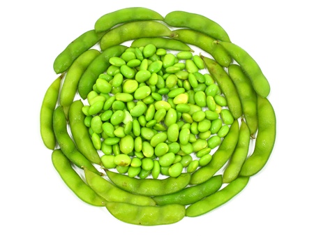 Edamame soy beans shelled and pods on white background の写真素材
