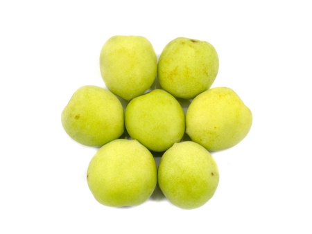 Fresh green plum in flower shape isolatedの写真素材