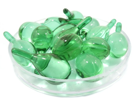Hair vitamin serum capsule in container on white backgroundの写真素材