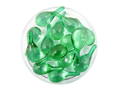 Hair vitamin serum capsule in container on white backgroundの写真素材
