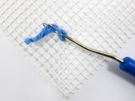 Latch Hook Rug stitch with canvas and yarnの写真素材