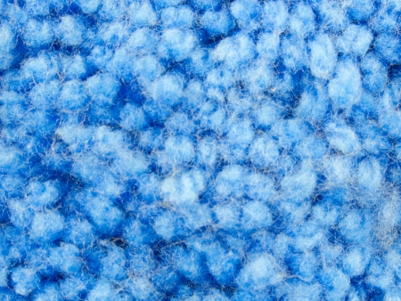 Texture of blue yarn carpet or rug on topの写真素材