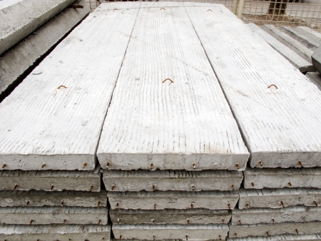 Stack of concrete building slab on ground in stockの写真素材