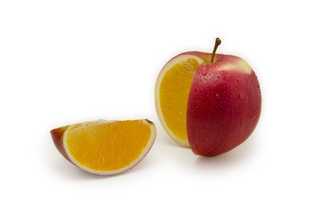 Red apple sliced, juicy orange inside  Isolated on white backgroundの写真素材