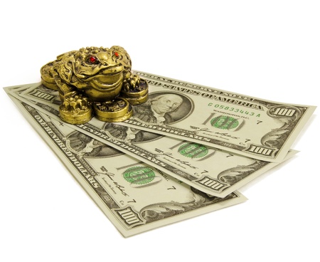 Feng Shui Money keeper frog sitting on money.の写真素材