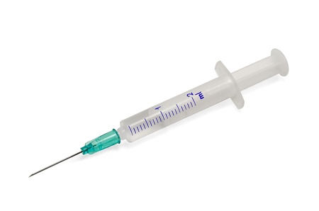 Plastic syringe with hypodermic needle isolated on white background.の写真素材
