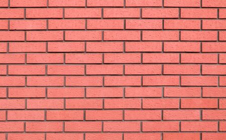 Reliable, Strong Brick Wall. Protective Structure. Coral Brick Wall Texture.の写真素材