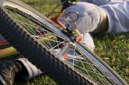 Man fell off the bike in the park.の写真素材