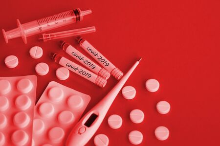 Covid-2019 virus concept. Syringe and ampoules with a vaccine against the virus.