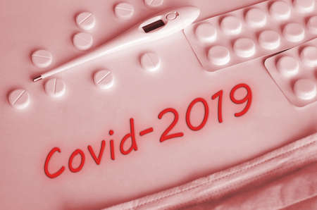 Covid-2019 virus concept. Various medicines: tablets, thermometer, mask.の写真素材