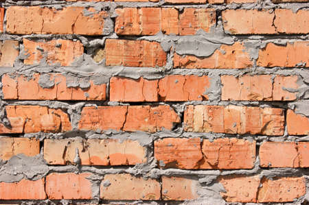 Old brick wall, old texture of red stone blocks closeup. Texture.