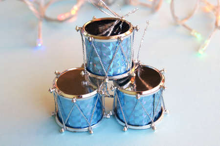 Christmas decoration for the Christmas tree in the form of drums on a blue background.の写真素材
