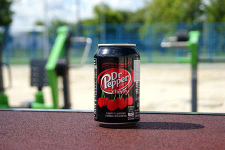KHARKOV, UKRAINE - JUNE 12, 2020: A metal bottle of Dr Pepper drink on the background of a street...