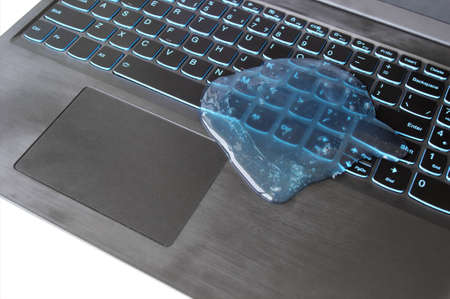 Blue soft gel cleaning dust on keyboard. Concept cleaning your computer's keyboard. Office cleaning.