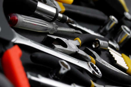 Many different tools for repair work on a black background. Repair and construction concept.の写真素材