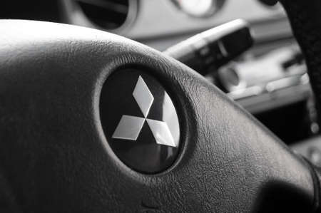 KHARKOV, UKRAINE - MAY 25, 2020 : Mitsubishi Outlander, Macro photo of a car emblem on the steering wheel.のeditorial素材