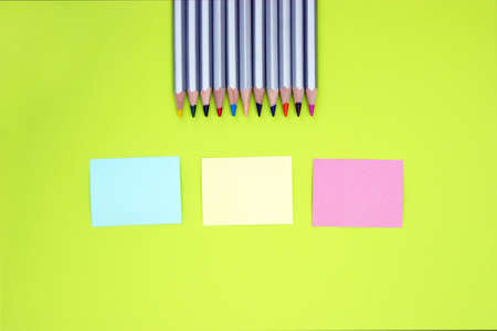 Three blank stickers and colorful pencils. Place for text. Copy space.の写真素材