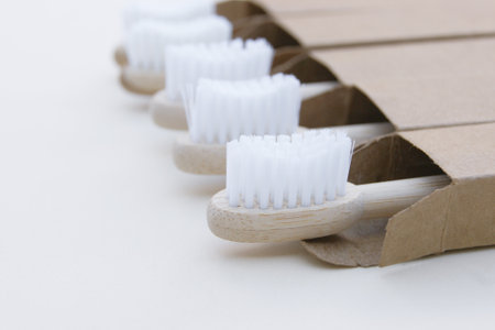 A family set of five eco friendly wooden bamboo toothbrushes.