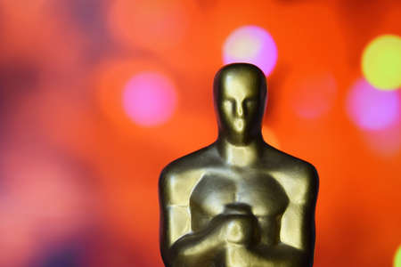 KHARKIV, UKRAINE - OCTOBER 23, 2021: Statue of the Hollywood Golden Oscar. The concept of success and victory in the film industry.のeditorial素材
