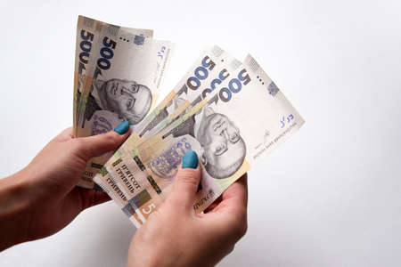 In the hands of the new banknotes in denominations of 500 hryvnia. Ukrainian money. Business...