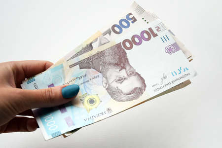 In the hands of the new banknotes in denominations of 500 and 1000 hryvnia. Ukrainian money....