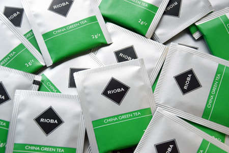 Kharkiv, Ukraine - November 5, 2021: Lots of Rioba tea bags. Green and black tea.のeditorial素材