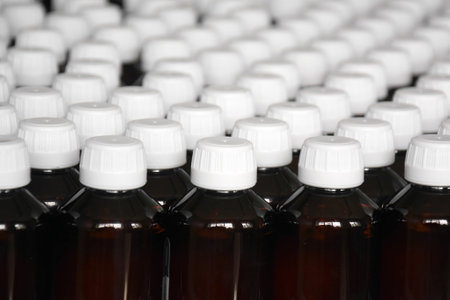 Production line conveyor with plastic bottles in a factory. pharmaceutical industry.の写真素材