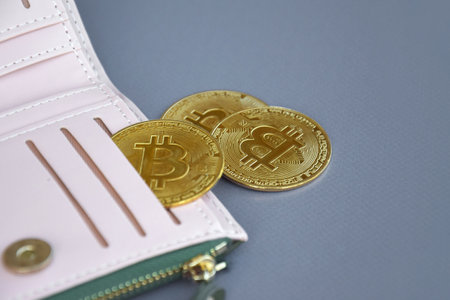 Kharkiv, Ukraine - October 7, 2022: US Dollar and Digital money Bitcoin coin Put together. Concept...