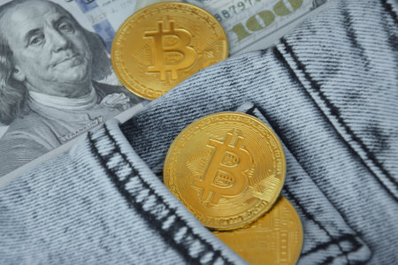 Kharkiv, Ukraine - October 7, 2022: US Dollar and Digital money Bitcoin coin Put together. Concept of digital money is becoming a competitor in major currencies such as the dollar.のeditorial素材