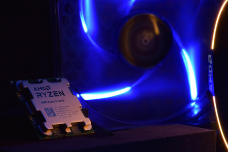 Close-up of an AMD Ryzen 9 3900X processor, against the backdrop of coolers with light.のeditorial素材