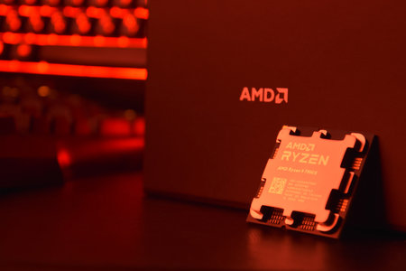 UKRAINE, KHARKIV, NOVEMBER 14, 2022: A close-up of an AMD Ryzen 9 3900X processor in a packaging box with backlit keyboards in the background.のeditorial素材